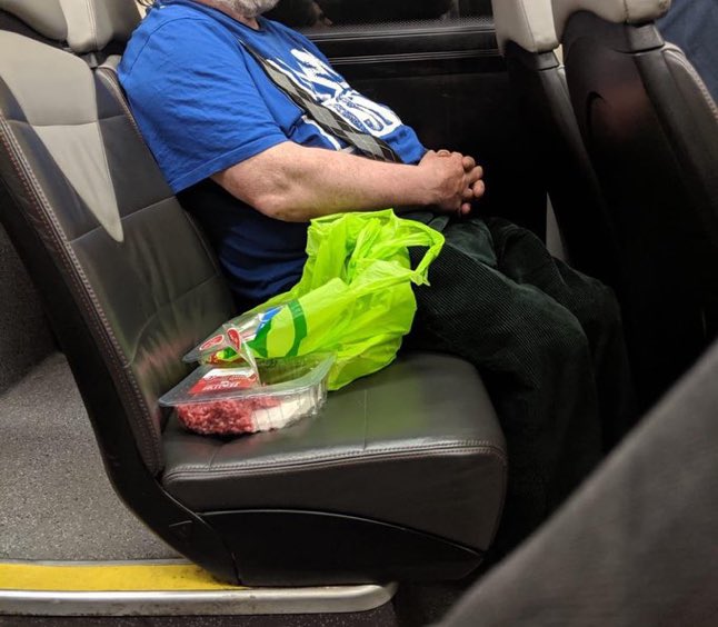 Man spotted eating raw meat in the bus