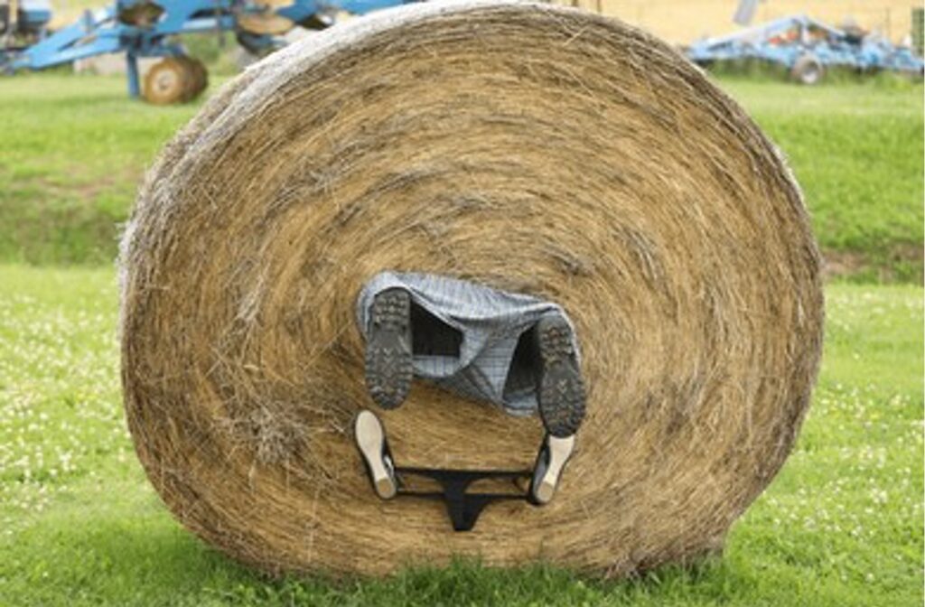 Young farmer takes roll in the hay to whole new level